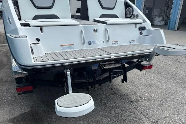 Slide: The Image of 2023 Yamaha Boats 222SD rear view, featuring swim platform and seating. - 6