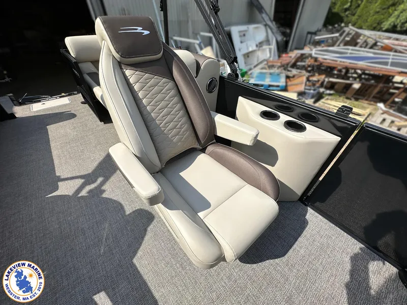 Slide: The Image of 2025 Bennington 22 SSR boat seat with armrests and cup holders, featuring luxurious upholstery. - 10