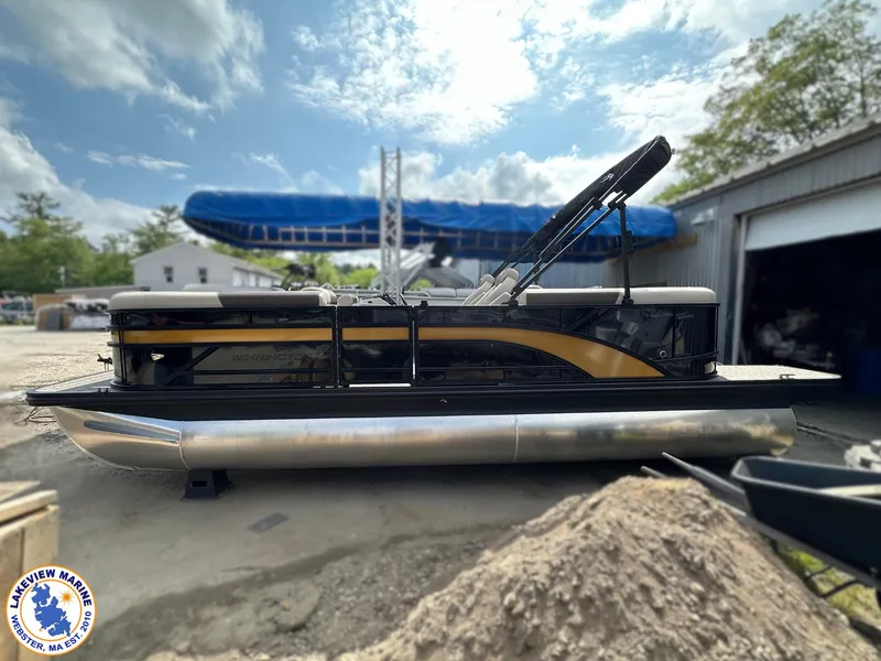 Slide: The Image of 2025 Bennington 22 SSR pontoon boat at Lakeview Marine, Webster, MA, under a partly cloudy sky. - 3