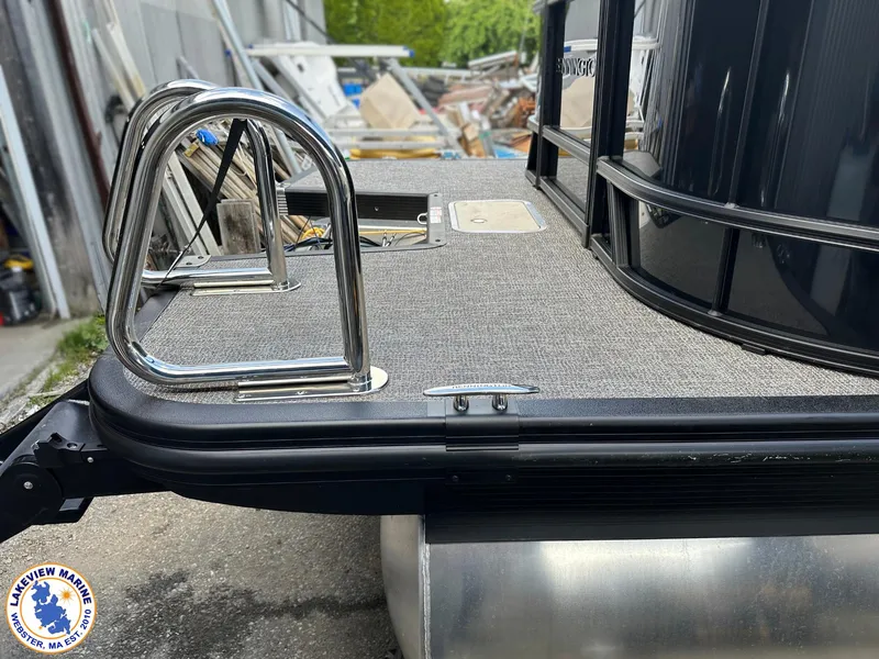 Slide: The Image of 2025 Bennington 22 SSR pontoon boat with stainless steel ladder and carpeted deck. - 4