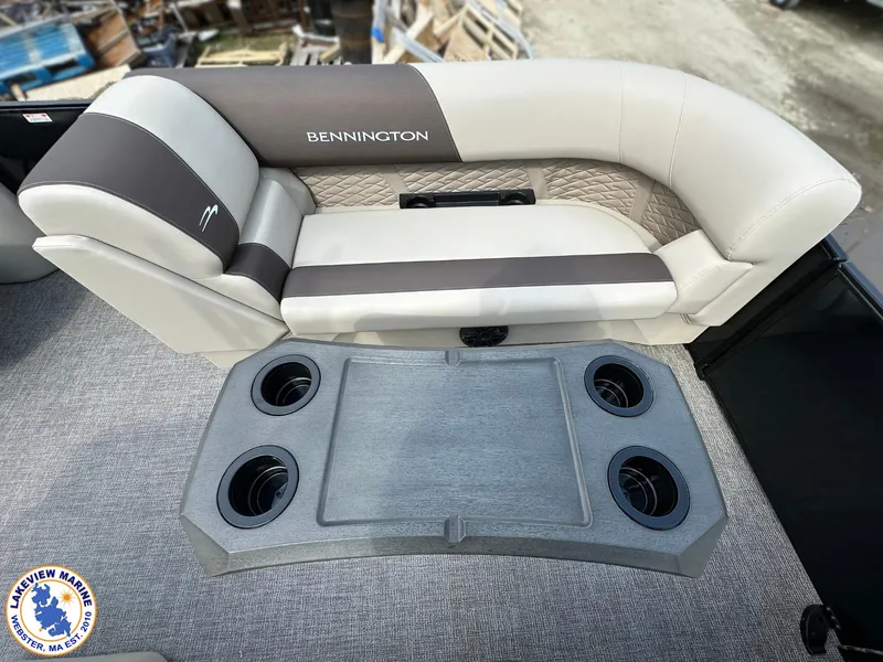 Slide: The Image of 2025 Bennington 22 SSR boat seating with cup holders, featuring elegant upholstery design. - 6