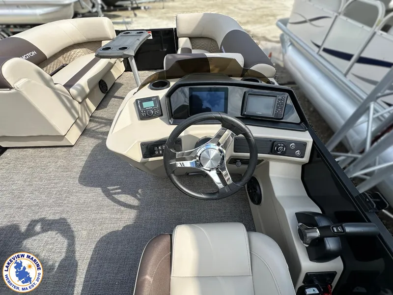 Slide: The Image of 2025 Bennington 22 SSR boat interior with steering wheel, dashboard, and seating area. - 7