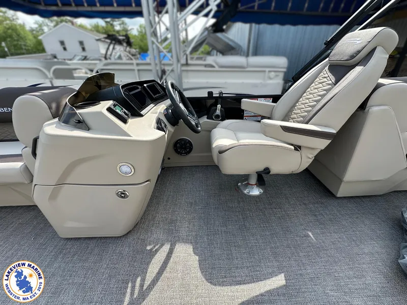 Slide: The Image of 2025 Bennington 22 SSR boat interior with captain's chair and control panel. - 8