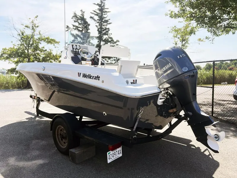 Slide: The Image of 2020 Wellcraft 182 Fishmaster boat with Yamaha 115 engine on trailer, parked outdoors. - 10