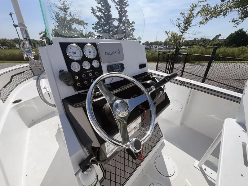 Slide: The Image of 2020 Wellcraft 182 Fishmaster boat dashboard with Garmin navigation and steering wheel. - 15