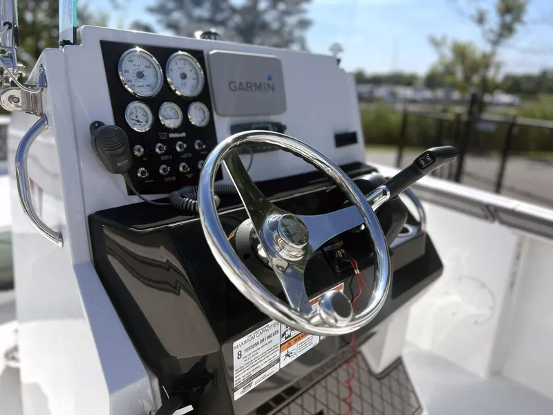 Slide: The Image of Steering console of 2020 Wellcraft 182 Fishmaster boat with Garmin navigation system. - 16