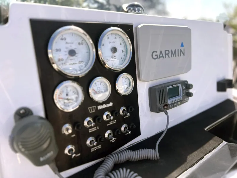 Slide: The Image of Control panel of 2020 Wellcraft 182 Fishmaster with Garmin navigation system and gauges. - 22