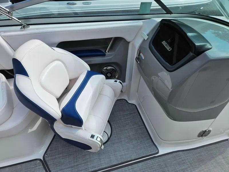 Slide: The Image of Interior of 2019 Chaparral 246 SSi boat with white and blue seating. - 16