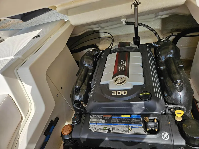 Slide: The Image of 2019 Chaparral 246 SSi boat engine compartment with Mercury 6.2L 300 HP engine. - 19