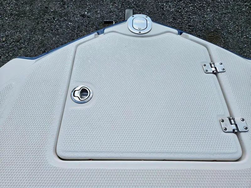 Slide: The Image of 2019 Chaparral 246 SSi boat deck with textured surface and metal fittings. - 24