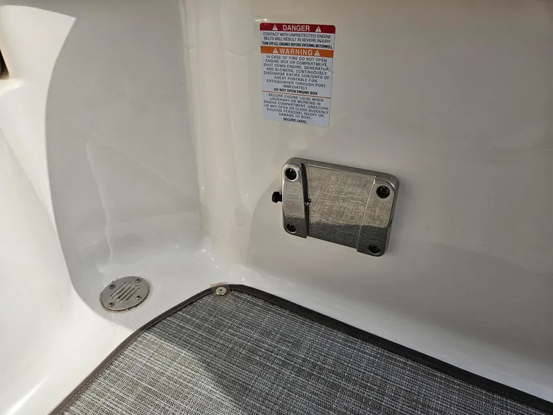 Slide: The Image of Interior view of 2019 Chaparral 246 SSi boat with safety warning label. - 26