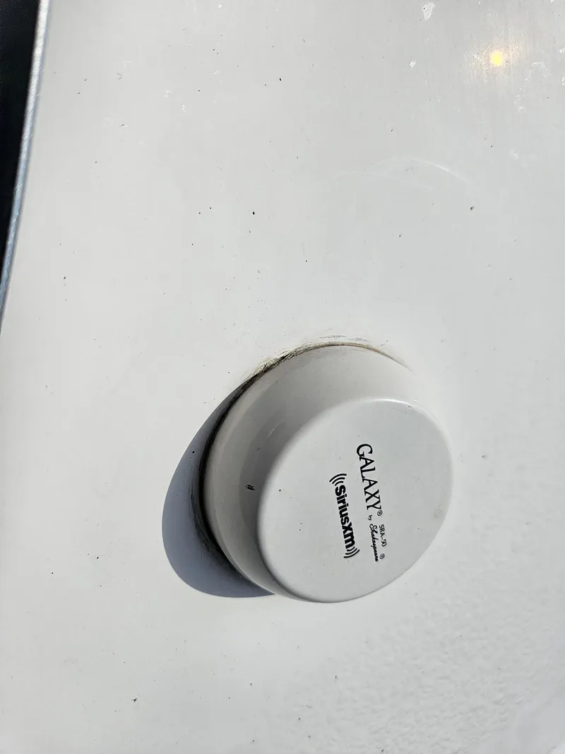 Slide: The Image of Close-up of a Galaxy SiriusXM antenna on a 2019 Chaparral 246 SSi boat. - 32