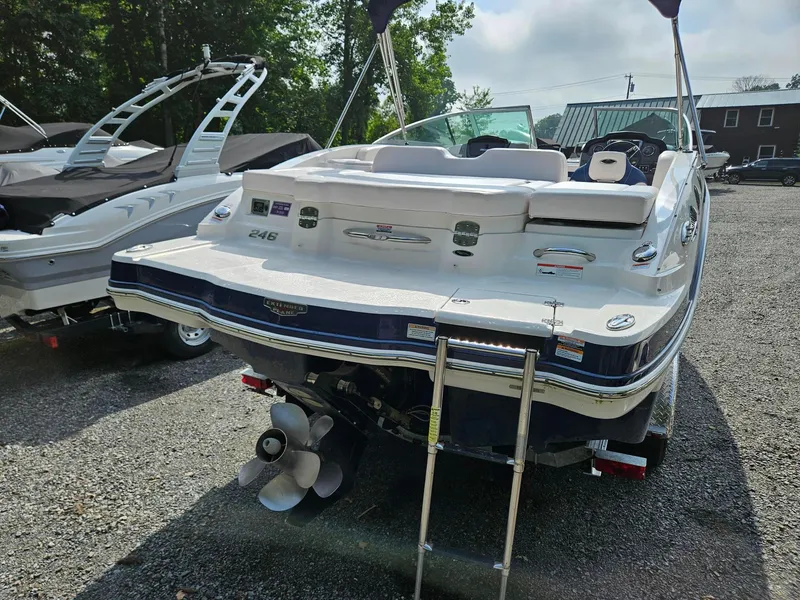 Slide: The Image of 2019 Chaparral 246 SSi boat, rear view with swim platform and ladder. - 4
