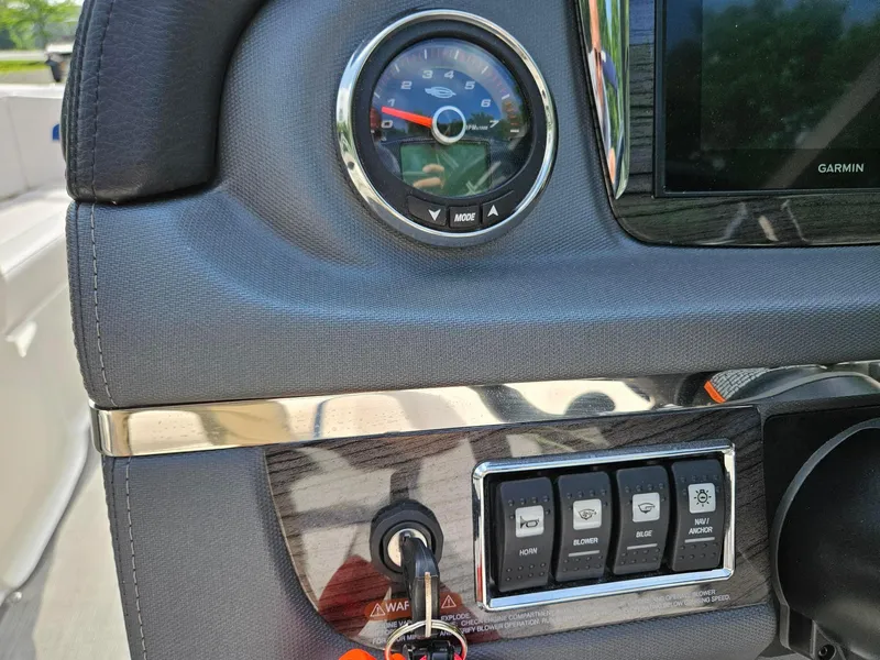 Slide: The Image of Dashboard of 2019 Chaparral 246 SSi boat with controls and gauges. - 9