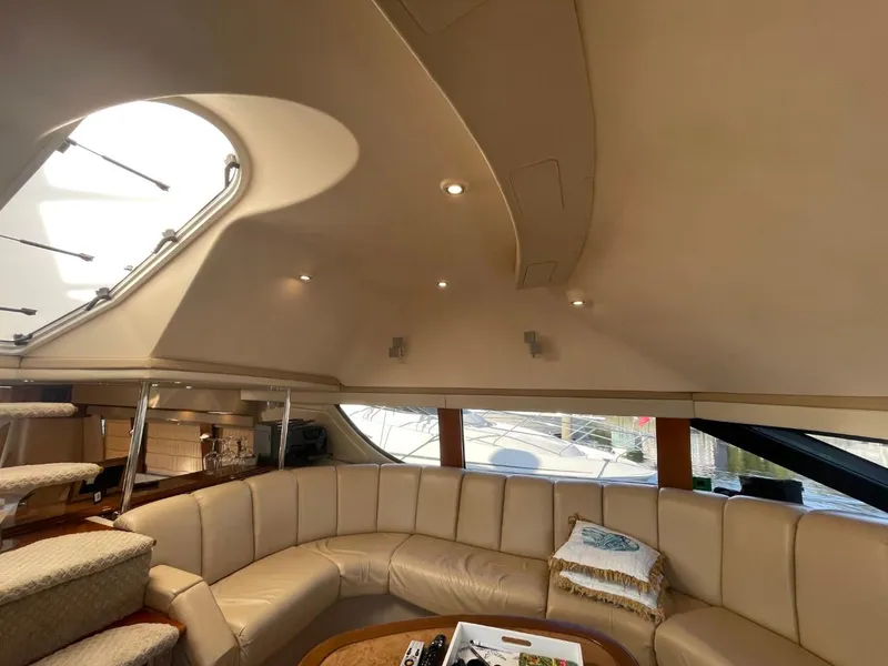 Slide: The Image of Luxurious interior of a 2006 Carver 56 Voyager yacht with plush seating and modern design. - 15