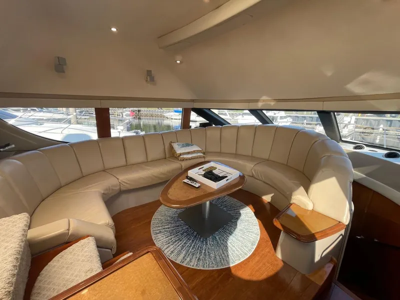 Slide: The Image of Luxurious interior of a 2006 Carver 56 Voyager yacht with plush seating and elegant decor. - 16