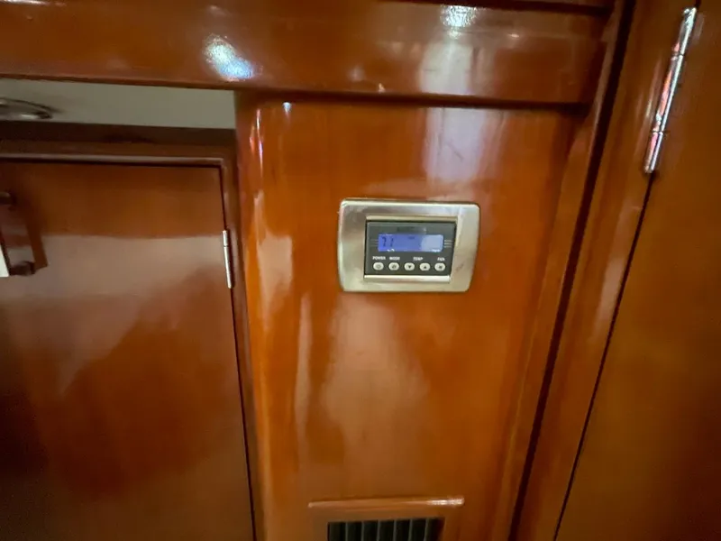 Slide: The Image of Control panel on 2006 Carver 56 Voyager yacht's wooden interior. - 45