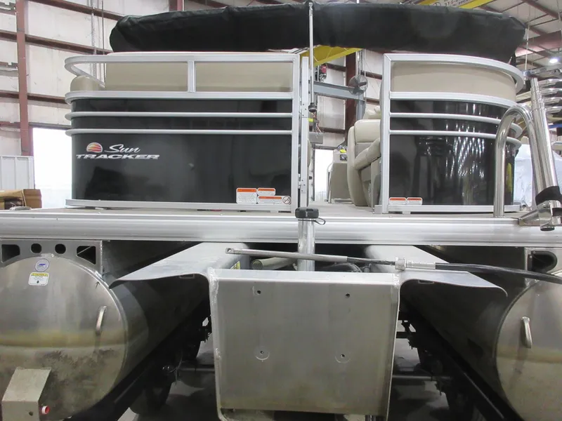 Slide: The Image of 2022 Sun Tracker Party Barge 22 RF DLX pontoon boat in a warehouse setting. - 3