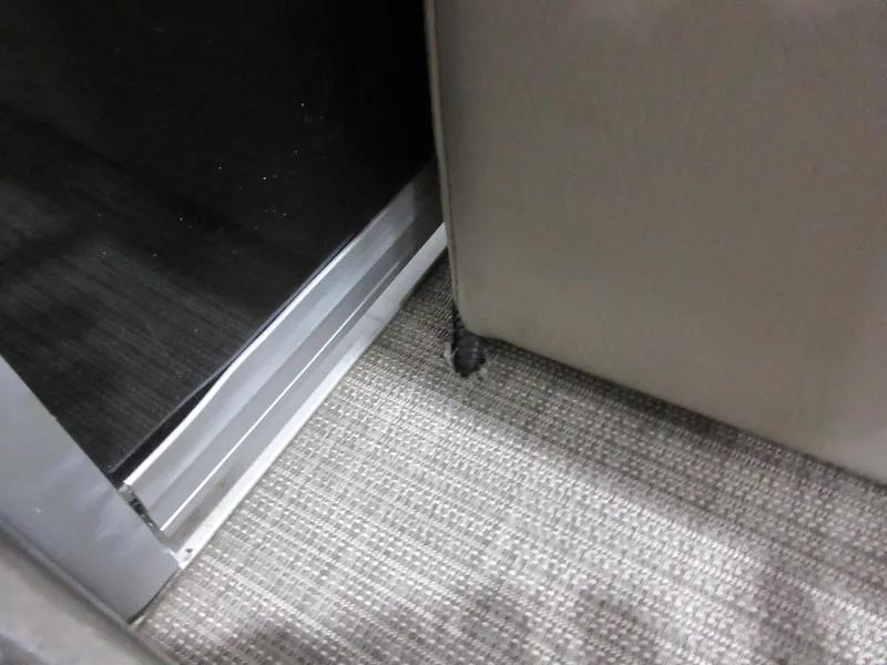 Slide: The Image of Interior corner of 2022 Sun Tracker Party Barge 22 RF DLX with carpet and seat detail. - 8