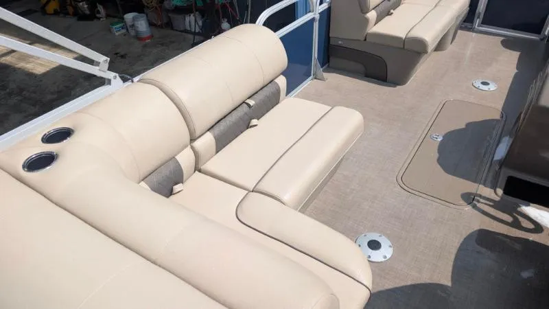 Slide: The Image of 2020 Sun Tracker Party Barge 22 RF XP3 interior with beige seating and cup holders. - 7