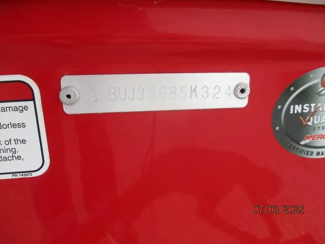 Slide: The Image of 2024 Tahoe T18 boat identification plate with serial number on red surface. - 5