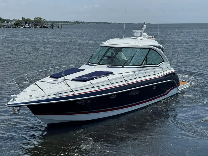 The Image of 2013 Formula 45 Yacht cruising on calm waters, showcasing sleek design and luxury features. - 0