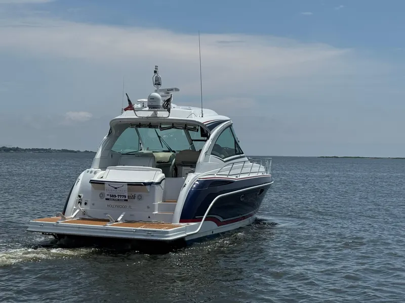 Slide: The Image of 2013 Formula 45 Yacht cruising on open water under a clear sky. - 10