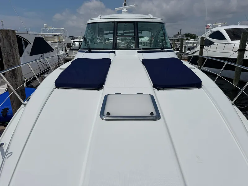 Slide: The Image of 2013 Formula 45 Yacht with blue cushions docked at marina. - 14