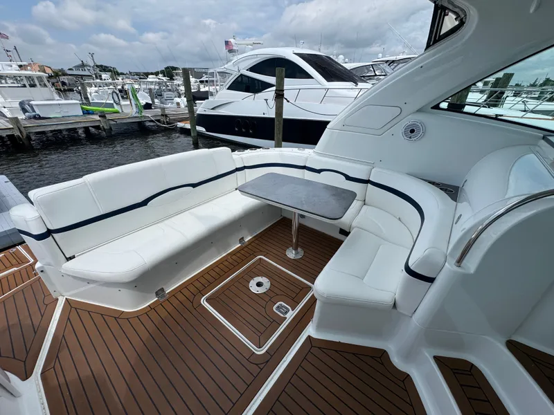 Slide: The Image of Luxurious 2013 Formula 45 Yacht with elegant seating and sleek design at a marina. - 19