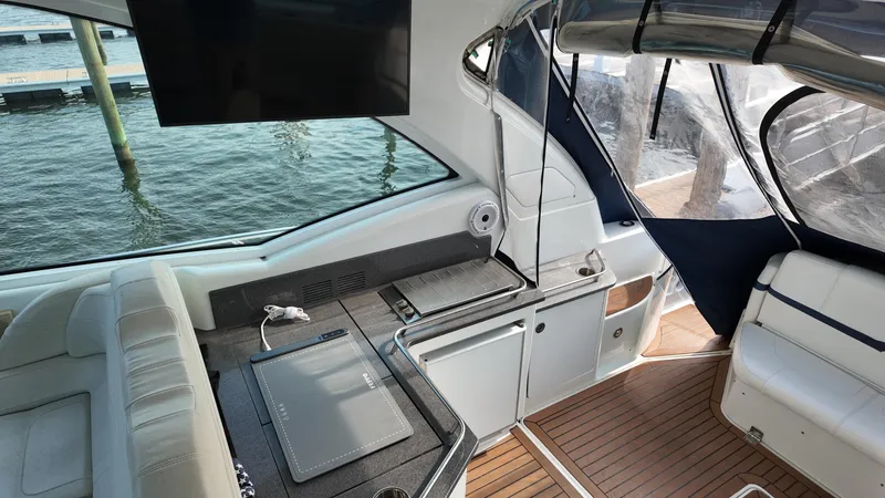 Slide: The Image of Interior of 2013 Formula 45 Yacht with seating, TV, and water view. - 21