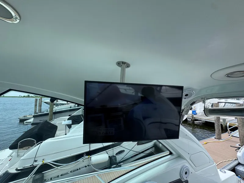 Slide: The Image of 2013 Formula 45 Yacht interior with mounted TV, docked at marina. - 22