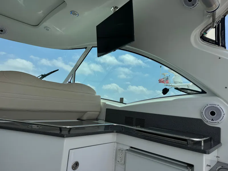 Slide: The Image of Interior of 2013 Formula 45 Yacht with seating, countertop, and window view. - 23