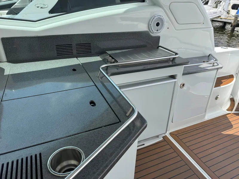 Slide: The Image of 2013 Formula 45 Yacht outdoor kitchen with sleek countertops and modern amenities. - 24