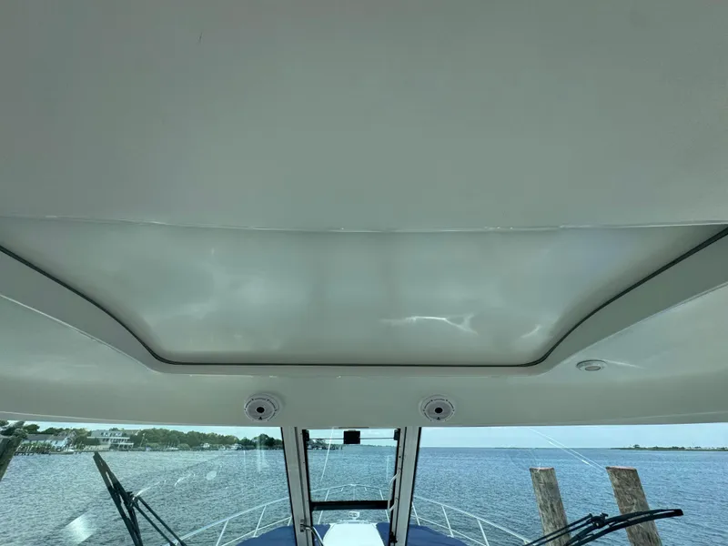 Slide: The Image of 2013 Formula 45 Yacht interior view with water and shoreline in background. - 26