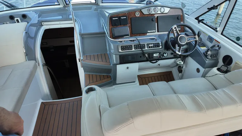 Slide: The Image of 2013 Formula 45 Yacht cockpit with modern navigation equipment and plush seating. - 27