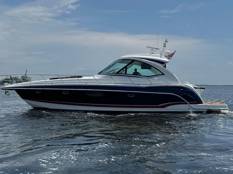 Slide: The Image of 2013 Formula 45 Yacht cruising on open water under a clear sky. - 3