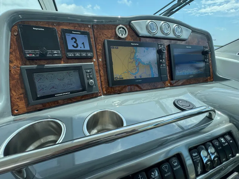 Slide: The Image of Dashboard of a 2013 Formula 45 Yacht with navigation and control displays. - 30