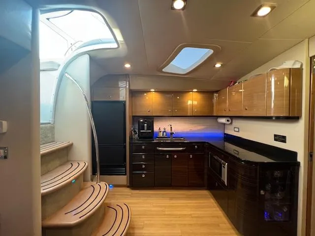 Slide: The Image of Interior of 2013 Formula 45 Yacht with modern kitchen and elegant staircase. - 32