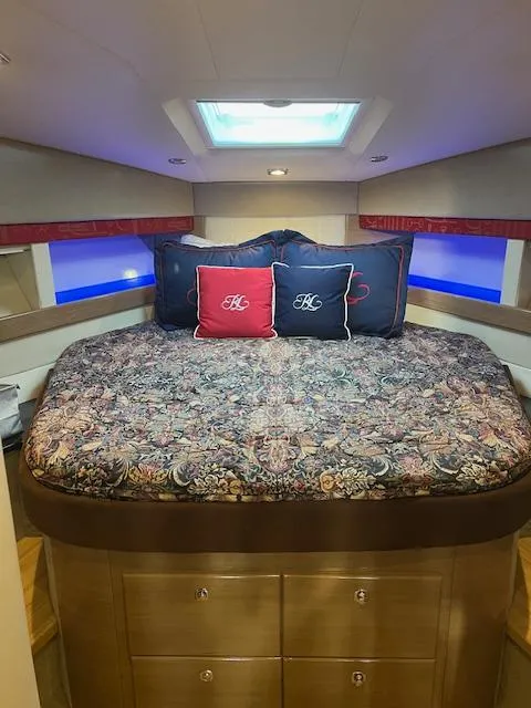 Slide: The Image of Luxurious bedroom interior of 2013 Formula 45 Yacht with patterned bedding and decorative pillows. - 37