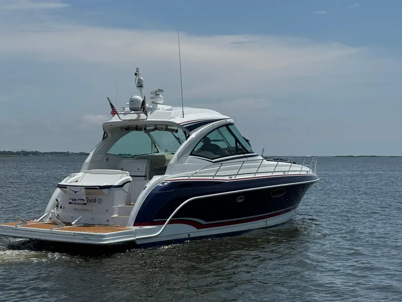 Slide: The Image of 2013 Formula 45 Yacht cruising on calm waters under a clear sky. - 4