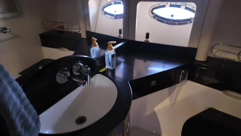 Slide: The Image of Luxurious bathroom interior of 2013 Formula 45 Yacht with modern sink and porthole windows. - 40