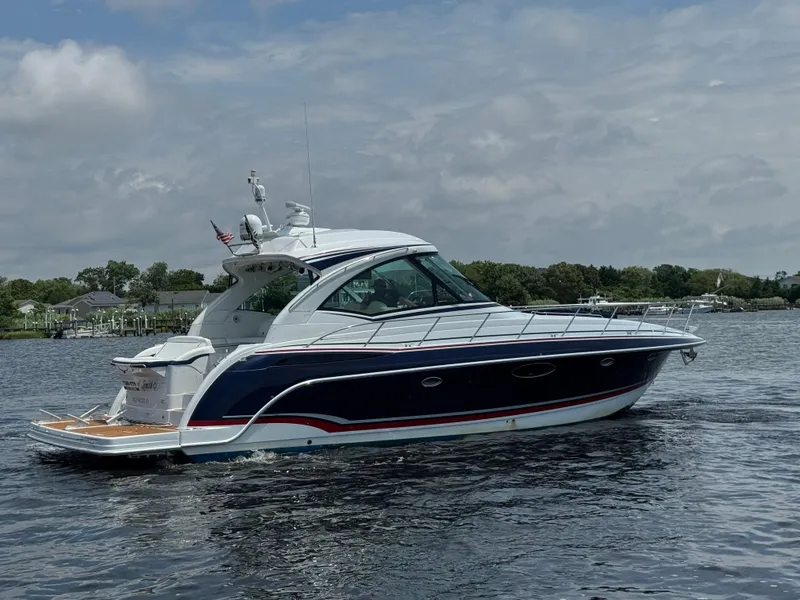 Slide: The Image of 2013 Formula 45 Yacht cruising on a calm lake under a cloudy sky. - 8