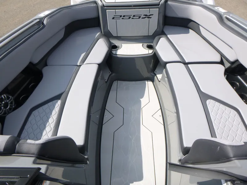 Slide: The Image of 2025 Yamaha Boats 255XE interior with sleek seating and modern design. - 10