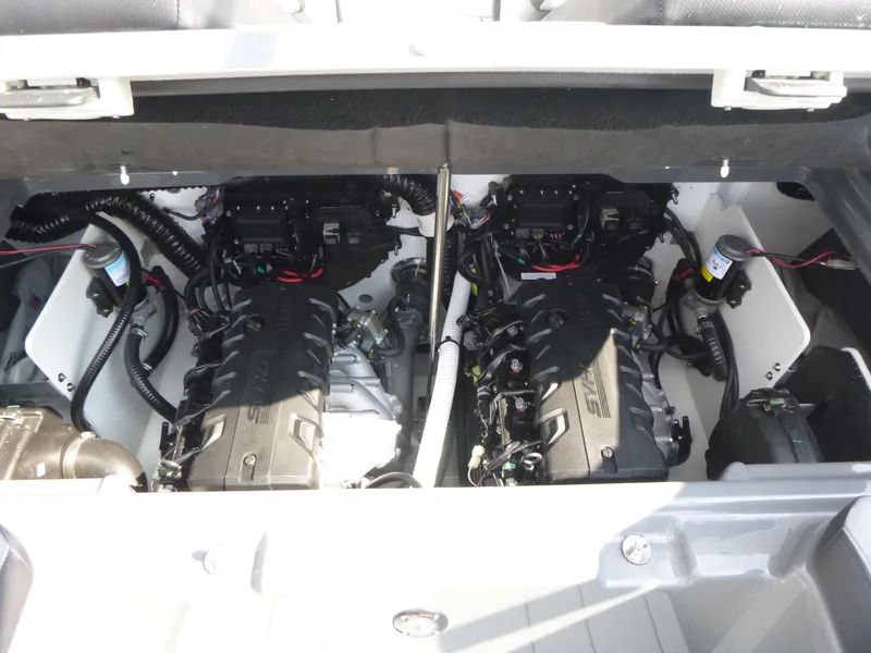 Slide: The Image of Engine compartment of 2025 Yamaha Boats 255XE, showcasing dual engines and wiring. - 17