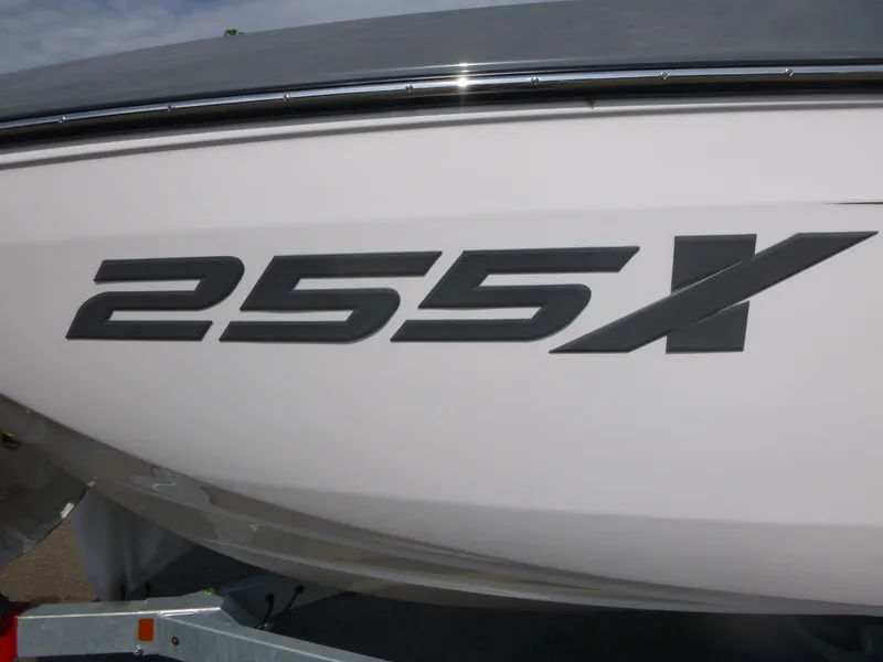 Slide: The Image of 2025 Yamaha Boats 255XE model logo on white boat exterior. - 18