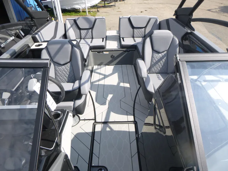 Slide: The Image of 2025 Yamaha Boats 255XE interior with modern seating and sleek design. - 5