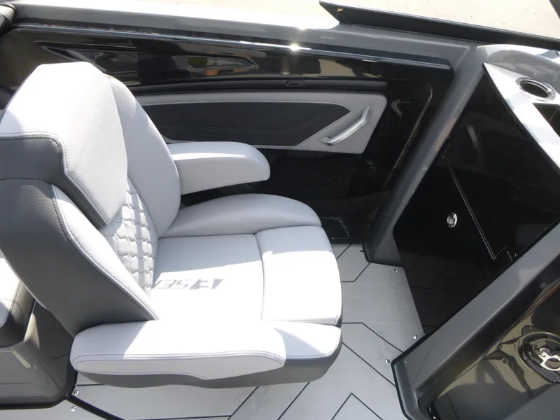 Slide: The Image of 2025 Yamaha Boats 255XE interior with sleek seating and modern design. - 8