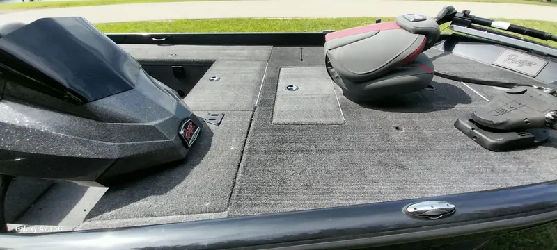 Slide: The Image of 2024 Ranger RT178C boat interior with seating and storage compartments. - 14