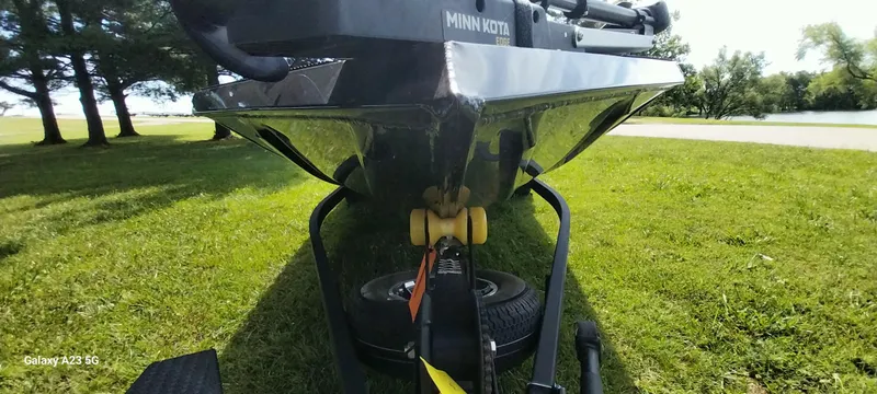 Slide: The Image of 2024 Ranger RT178C boat on trailer, grassy park setting, sunny day. - 18