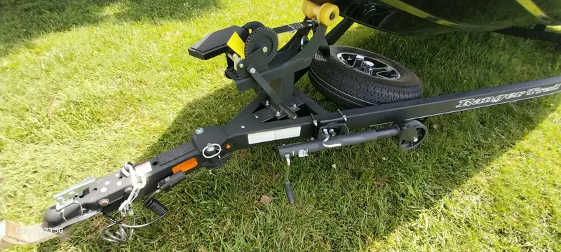 Slide: The Image of 2024 Ranger RT178C trailer hitch and spare tire on grass. - 20